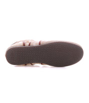 The image shows the bottom view of a Bed Stu Scurry II shoe featuring a beige upper, dark brown textured rubber sole, simple tread pattern, and a low-profile silhouette.