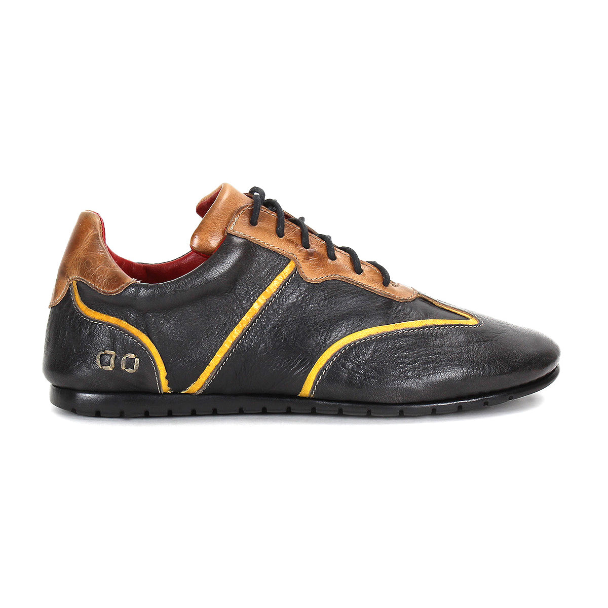 The Bed Stu Scurry is a women’s shoe in black vegetable-tanned leather with brown accents, yellow trim, and black laces, shown from the left side against a white background.