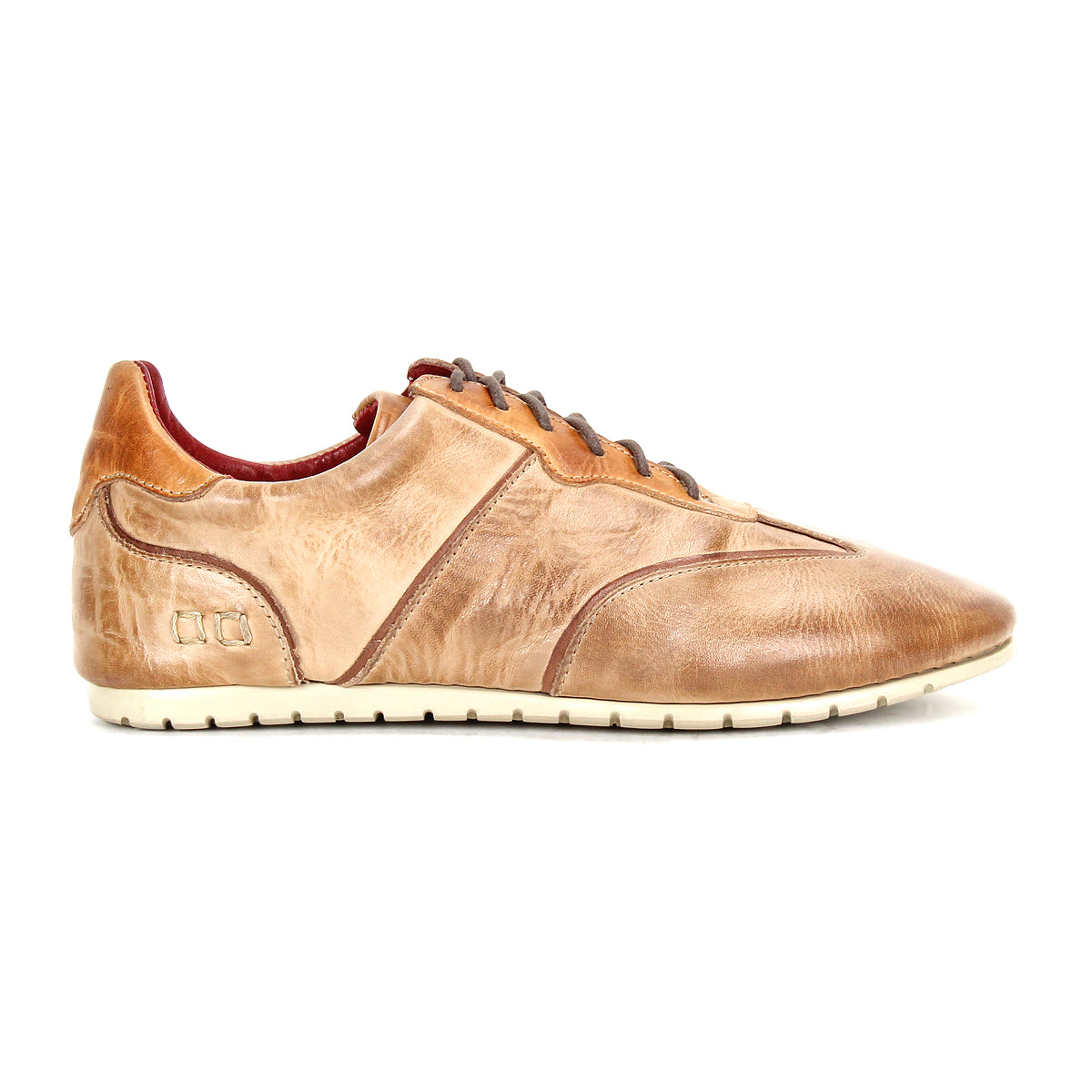 The Bed Stu Scurry is a women’s shoe crafted from vegetable-tanned leather with brown laces, side stitching, and a white rubber sole, shown in profile against a white background.