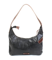 The Seemly by Bed Stu is a black compact shoulder bag with brown accents, buckle detail, single strap, and zippered top, displayed against a white background—ideal for everyday style.