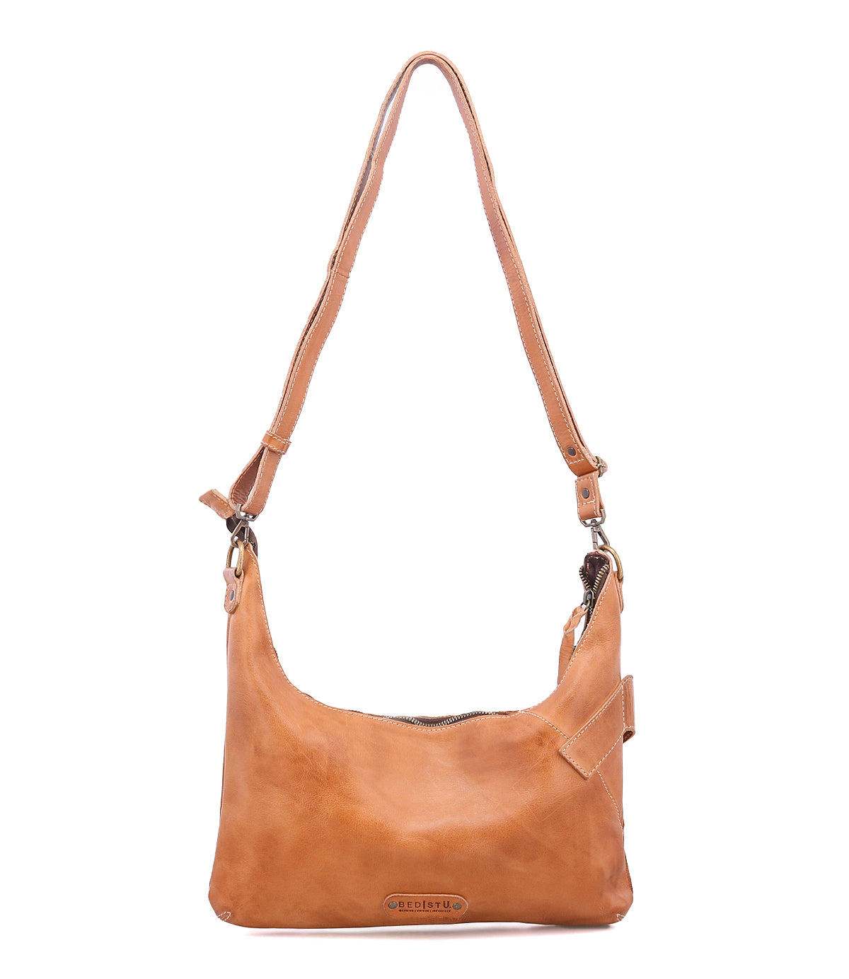 The Bed Stu Seemly is a light brown leather shoulder bag with a buckle detail, adjustable strap, and zipper closure—perfect for everyday styling. Shown against a plain white background.