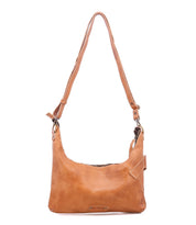 The Bed Stu Seemly is a light brown leather shoulder bag with a buckle detail, adjustable strap, and zipper closure—perfect for everyday styling. Shown against a plain white background.