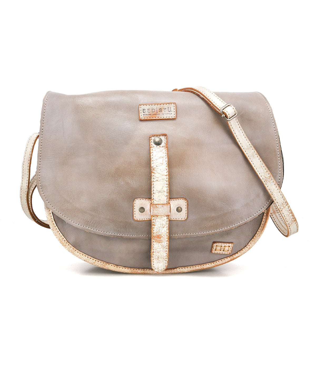 The Sequoia by Bed Stu is a gray crossbody bag made from vegetable-tanned leather, featuring tan trim, stitched details, a flap closure, and an adjustable strap.