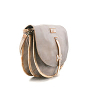 The Bed Stu Sequoia crossbody bag in vegetable-tanned leather features a flap closure, tan trim, and an adjustable strap, showcased on a white background.