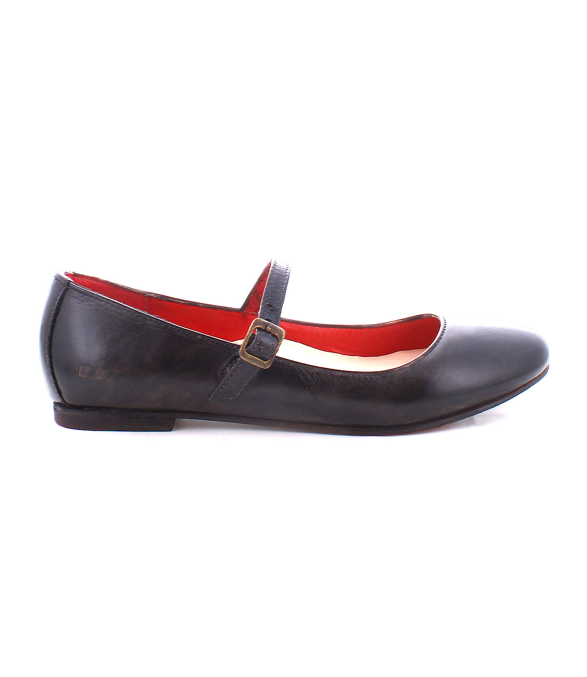 The Shuffle III by Bed Stu is a black leather Mary Jane ballet flat with an adjustable strap and buckle on the side. The interior lining is red, embracing the ballerinacore trend perfectly.