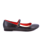 The Shuffle III by Bed Stu is a black leather Mary Jane ballet flat with an adjustable strap and buckle on the side. The interior lining is red, embracing the ballerinacore trend perfectly.