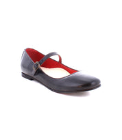A single black ballet flat shoe with an adjustable strap and buckle across the top, featuring a red interior lining. Perfect for those embracing the ballerinacore trend, the Shuffle III by Bed Stu is a stylish choice.