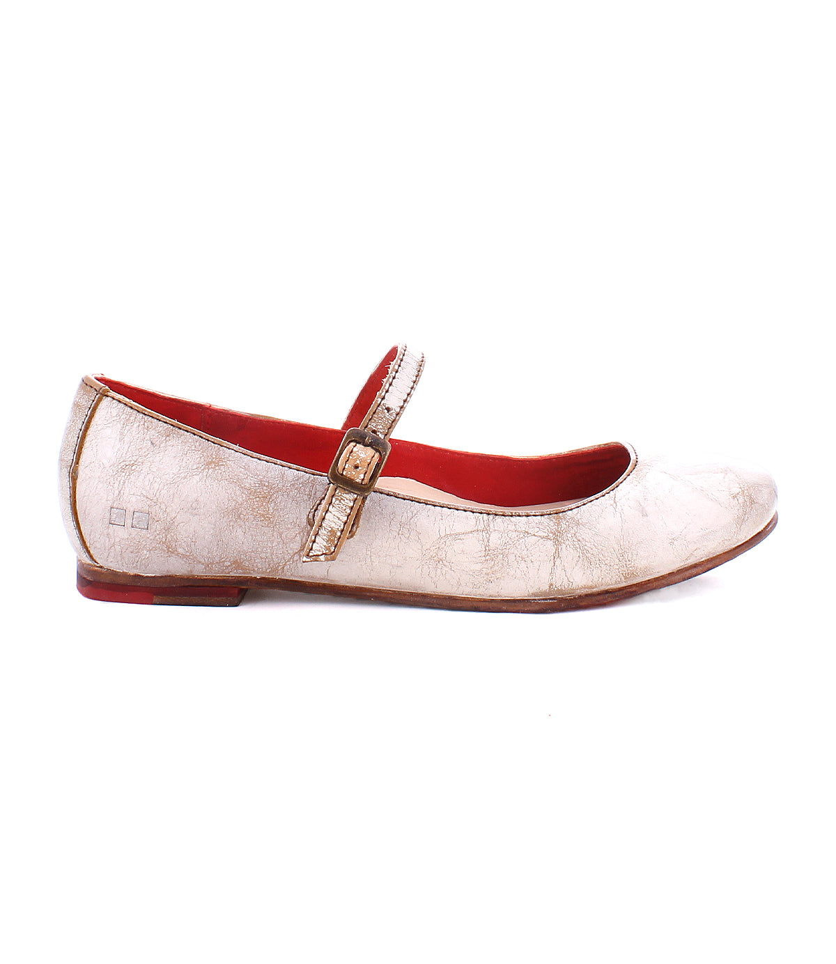 A worn Bed Stu Shuffle III with an adjustable strap, featuring a beige exterior and red interior lining, viewed from the side against a white background.