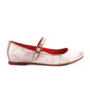 A worn Bed Stu Shuffle III with an adjustable strap, featuring a beige exterior and red interior lining, viewed from the side against a white background.
