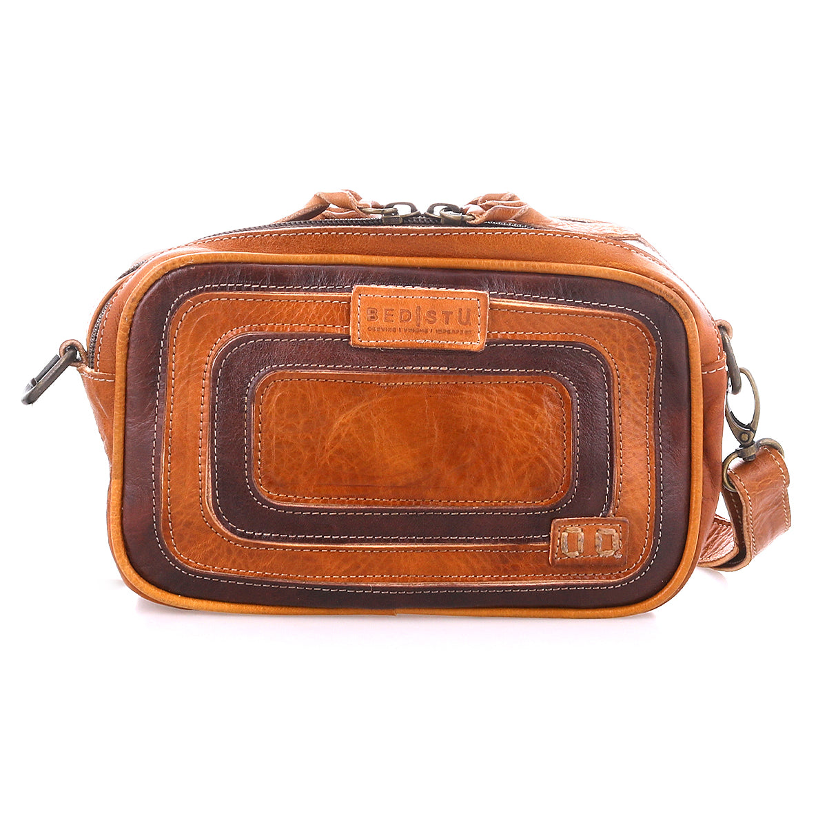 Stay organized with the Bed Stu Shy crossbody—crafted from brown leather, featuring a rectangular front, visible stitching, premium leather accents, a top zipper closure, and an adjustable shoulder strap for easy carrying.