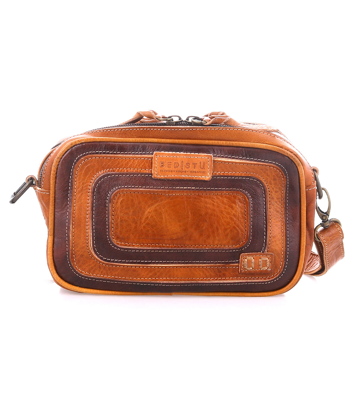 Stay organized with the Bed Stu Shy crossbody—crafted from brown leather, featuring a rectangular front, visible stitching, premium leather accents, a top zipper closure, and an adjustable shoulder strap for easy carrying.
