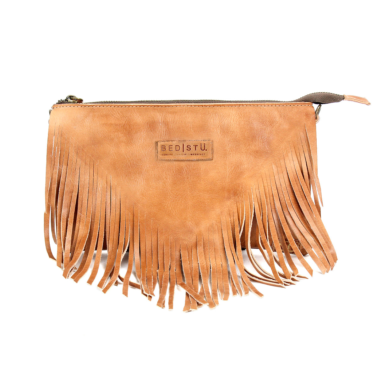 The Bed Stu Silverrock is a light brown leather crossbody clutch with fringe detailing, a visible logo, and a top zipper closure.