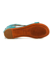 The Bed Stu Soto teal leather sandal features a tan sole with a textured grip section and smooth heel, making it ideal for daily adventures with its cushioned footbed.