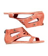 A pair of women’s open-toe, Soto Cutout wedge sandals in a pinkish-tan color, isolated on a white background. Brand: Bed Stu.