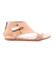 The Bed Stu Soto tan leather sandal features an ankle-high design, open side cutouts, brass snap buttons, cushioned footbed, back zipper, and flat sole for stylish comfort.