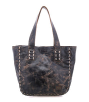 The Stevie by Bed Stu is a large distressed black leather tote with thick handles and edge stitching—ideal as an everyday carryall or a chic vintage-inspired handbag.