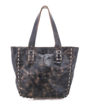 The Stevie by Bed Stu is a large black distressed leather tote bag with dual handles and white edge stitching—ideal for everyday use or as a vintage-inspired accessory.