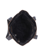 Top view of the empty, open Stevie leather tote by Bed Stu, ideal for everyday carry, with visible inner compartments and two shoulder straps.