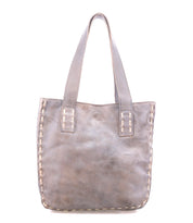 The Bed Stu Stevie is a gray leather tote bag featuring double handles and visible edge stitching, ideal for everyday carry, shown against a white background.