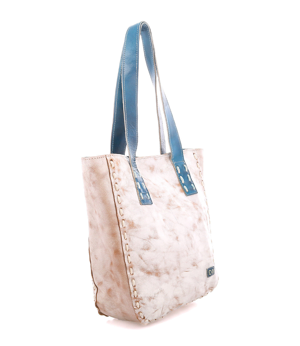 The Bed Stu Stevie is a large vintage-style leather tote with a distressed beige body, whipstitch edging, and contrasting blue leather shoulder straps—perfect for everyday carry.