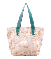 The Stevie by Bed Stu is a large vintage bag with a beige and white tie-dye pattern, tan side stitching, and wide teal handles—ideal for everyday use.