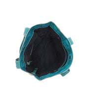 Top view of Bed Stu's Stevie tote in teal leather, showing a roomy black-lined interior with a side zip pocket—ideal for daily essentials. Two handles are also visible.