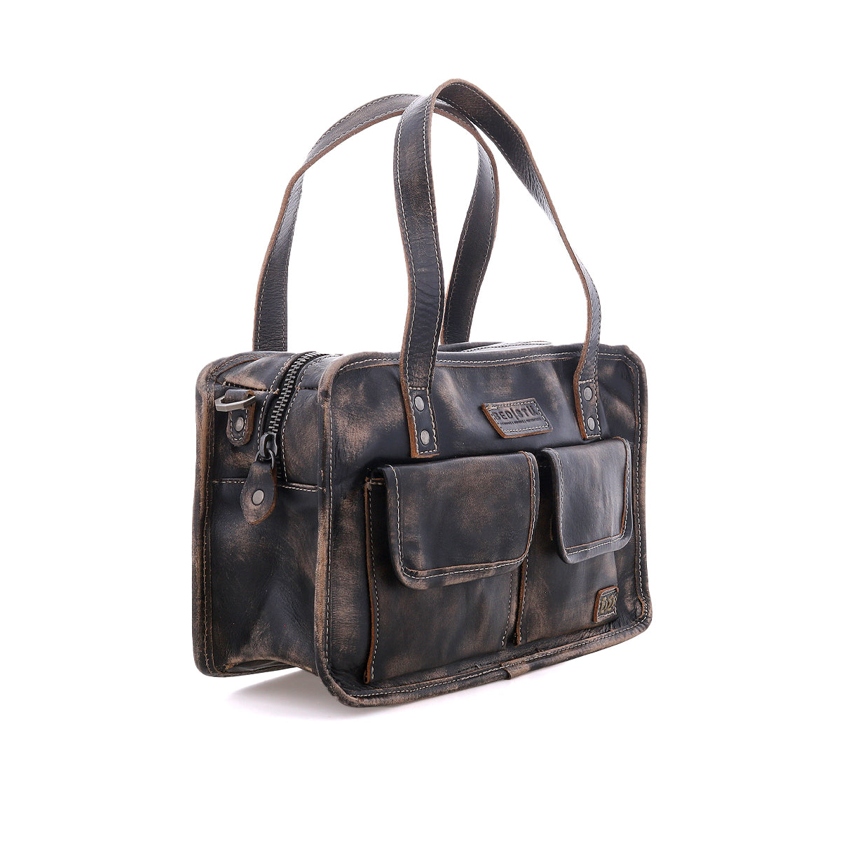 The Bed|Stü Stuffy handbag, crafted from brown distressed leather, boasts dual handles, a structured silhouette, two front flap pockets, a zipper closure, and a spacious interior, shown against a white background.