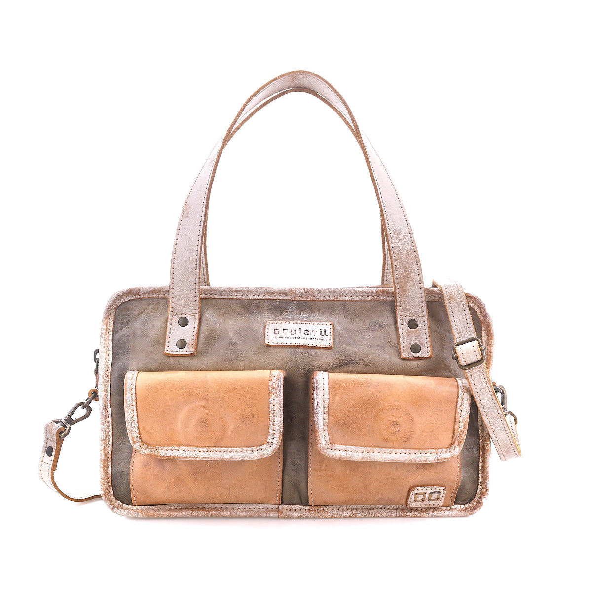 The Bed|Stü Stuffy is a rectangular leather handbag with a structured silhouette, featuring two front pockets, double handles, and a removable shoulder strap. Displayed against a white background, this preppy bag offers a spacious interior to hold all your essentials.