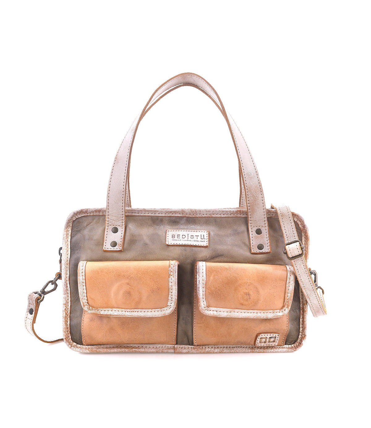 The Bed|Stü Stuffy is a rectangular leather handbag with a structured silhouette, featuring two front pockets, double handles, and a removable shoulder strap. Displayed against a white background, this preppy bag offers a spacious interior to hold all your essentials.