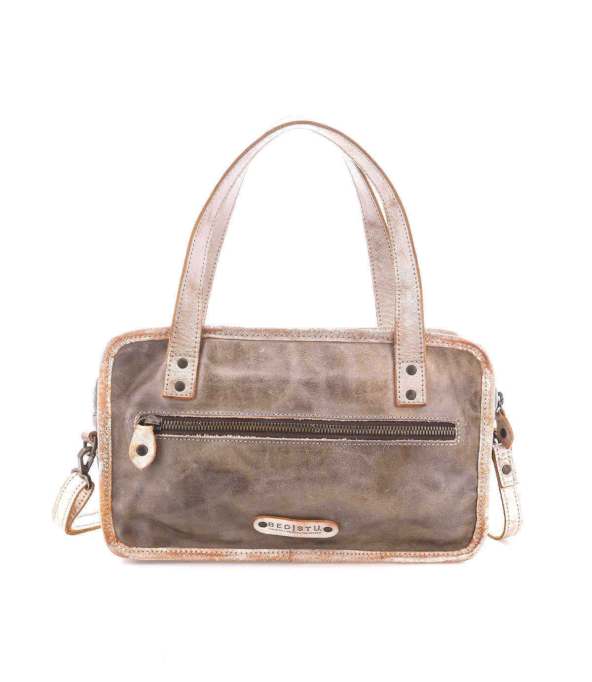 The Bed|Stü Stuffy is a rectangular brown leather handbag with a structured silhouette, double handles, a front zip pocket, and a detachable shoulder strap. It features a spacious interior and is displayed against a white background.