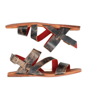 The Bed Stu Superb sandals feature flat leather soles, worn brown straps, an adjustable ankle strap with buckle closure, and red lining—shown side by side with opposing soles—perfect for everyday wear.