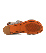 The Bed Stu Superb sandal features a textured orange-brown sole with a defined heel and visible leather straps along the edge—perfect for everyday wear.