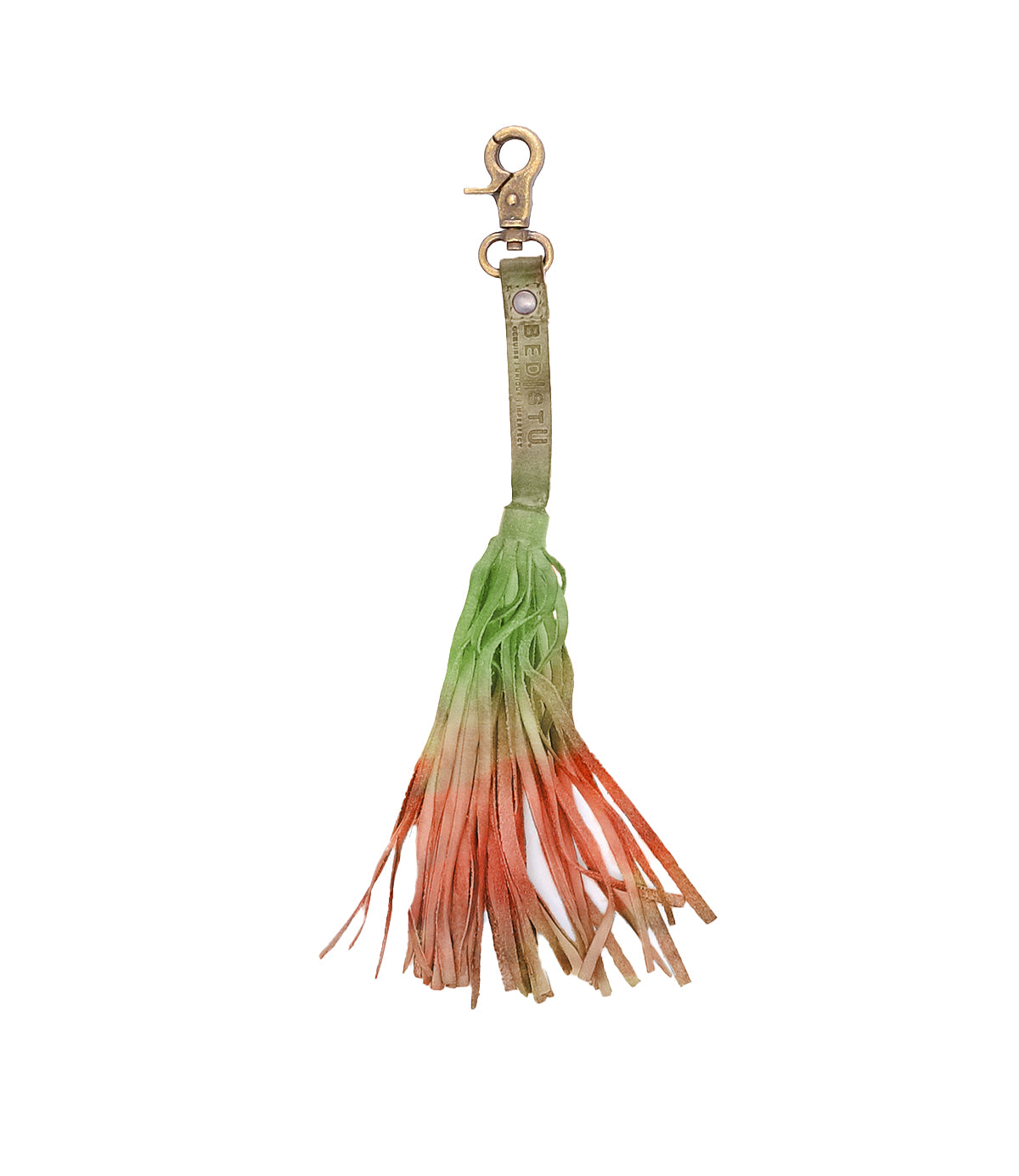The Bed Stu Tassel Clip features a multicolored ombre tassel with a metal clasp and high-quality leather strap, showcasing personal expression as the colors shift from green to orange and beige.