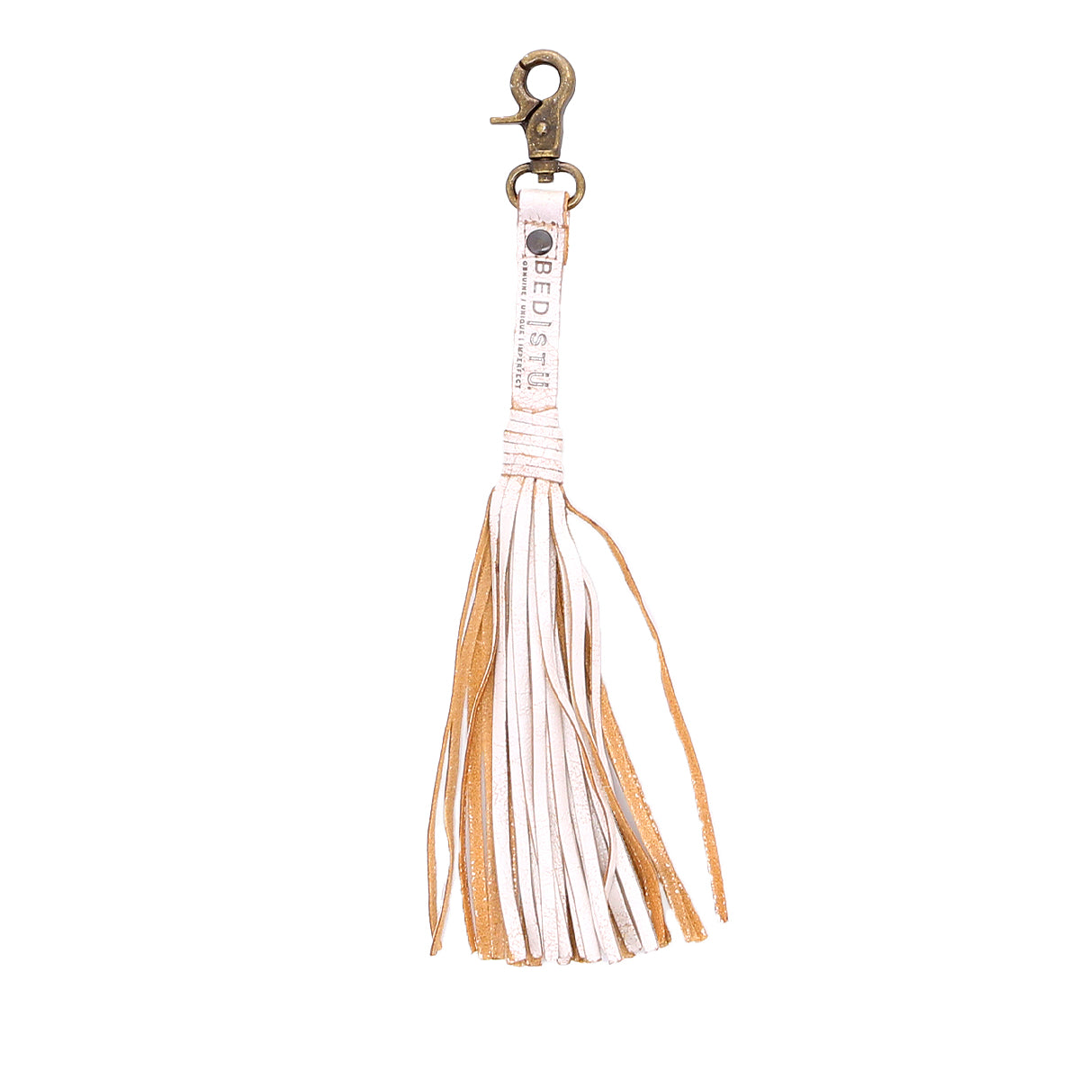 A white leather Tassel Clip keychain with tan tassels, perfect for adding a touch of personal expression to your accessories.