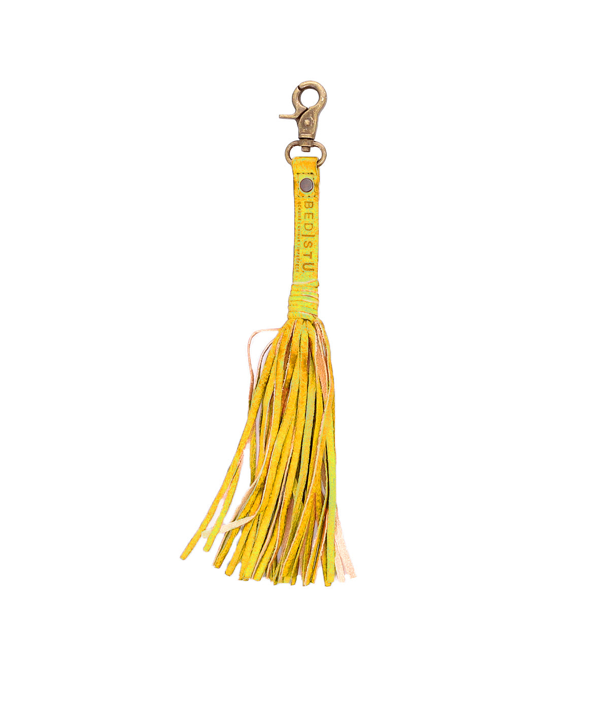 Yellow leather Tassel Clip by Bed Stu, made from premium leather with a metal clasp, featuring the brand's text on the strap. Ideal for personal expression, this piece adds elegance to any accessory collection.