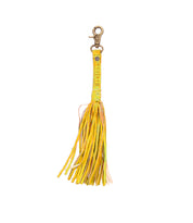 Yellow leather Tassel Clip by Bed Stu, made from premium leather with a metal clasp, featuring the brand's text on the strap. Ideal for personal expression, this piece adds elegance to any accessory collection.