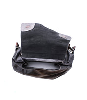 The Bed Stu Teji is a brown leather shoulder bag featuring a flap design, visible interior compartment, and magnetic snap closures—a versatile statement piece for any backpack lover.
