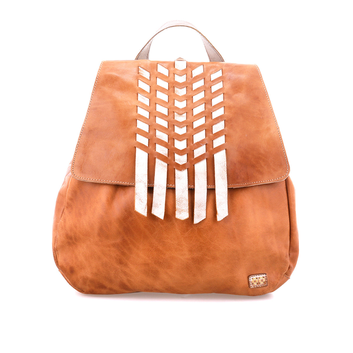 The Bed Stu Teji is a tan leather backpack with a flap closure, vertical silver chevron accents, and a small woven patch on the lower right corner.