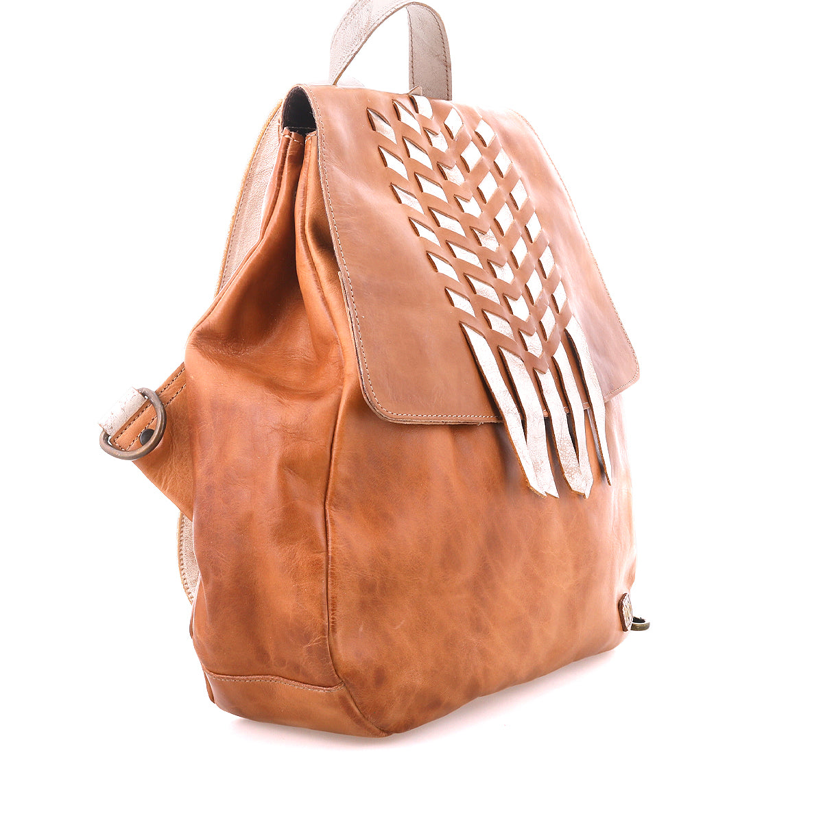 The Bed Stu Teji is a brown leather statement backpack with a flap closure and decorative cut-out pattern on the front, shown against a white background.