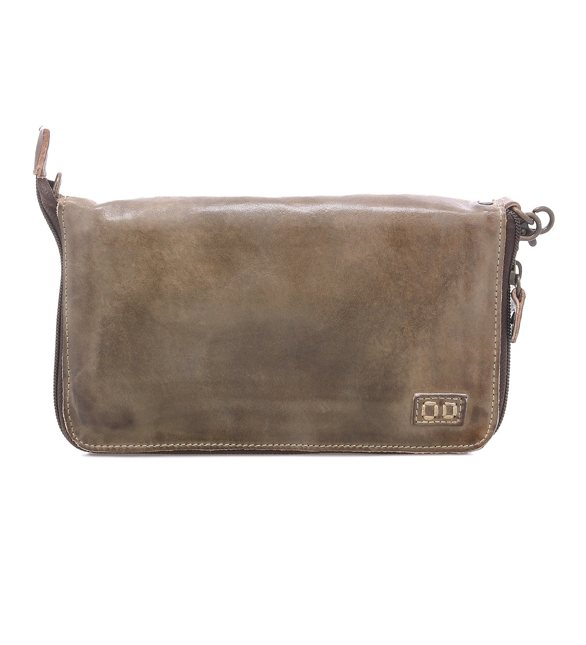 The Bed Stu Templeton II is a rectangular brown vegetable-tanned leather clutch with stitched edges, a zipper closure, and a small embossed logo in the bottom right corner.