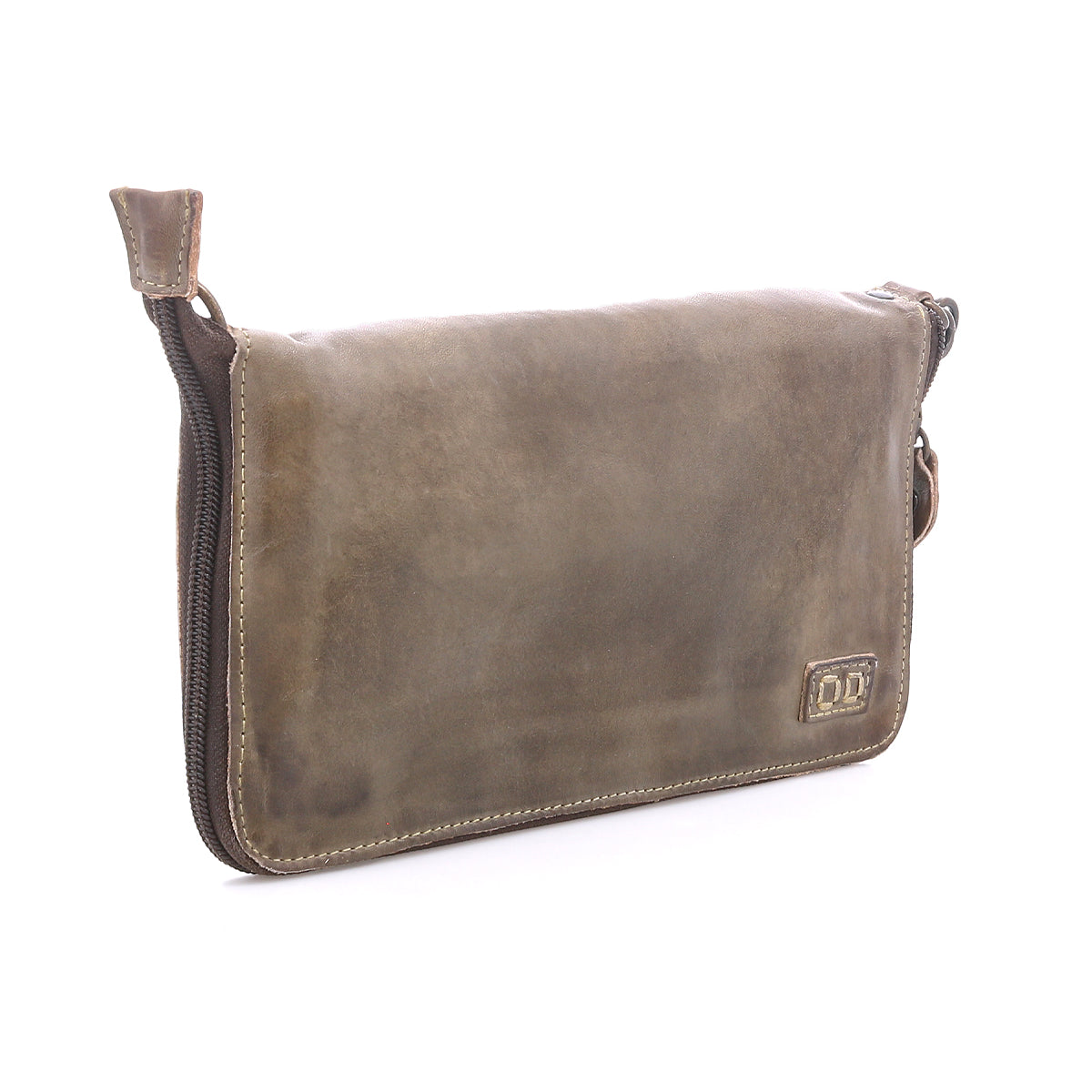The Bed Stu Templeton II is a rectangular pouch made from brown vegetable-tanned leather, featuring visible stitching, a zippered closure, and a small embossed logo on the lower right corner.