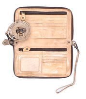 The Bed Stu Templeton II is an open tan vegetable-tanned leather wallet featuring multiple card slots, two zippered compartments, a transparent ID window, and a detachable strap coiled beside it.