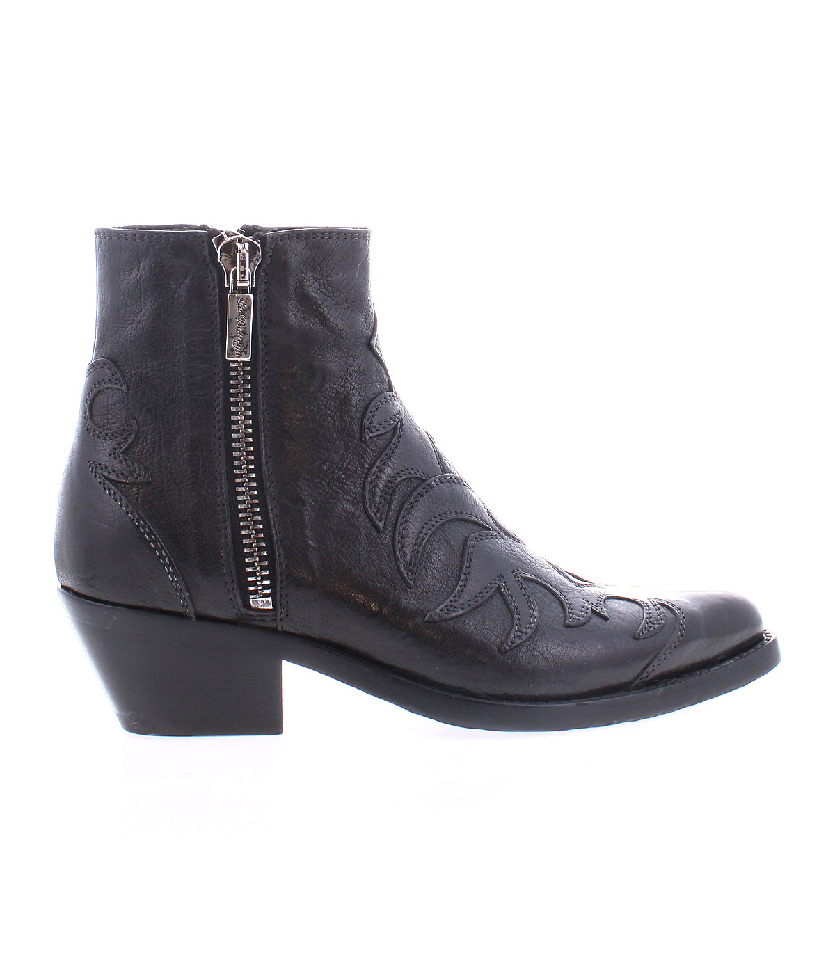 The Bed Stu Tentativa is a black leather ankle boot featuring artisan details, a side zipper, decorative stitching on the upper, and a low block heel, shown in profile against a white background.