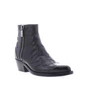 The Bed Stu Tentativa is a handcrafted black leather ankle boot with a side zipper, low heel, and decorative stitching for vintage Western style. Photographed on a white background.