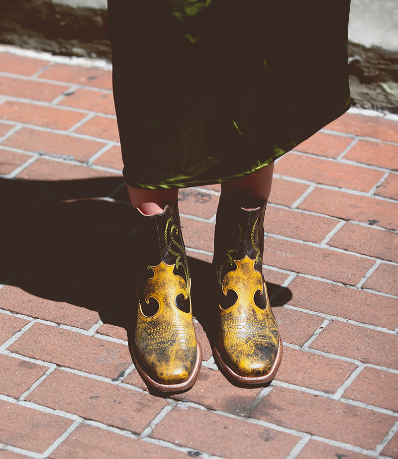Black and yellow western bootie