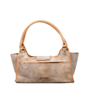 The Bed Stu Unbending is a tan washed leather shoulder bag with dual handles, a front zipper pocket, and a simple design, shown against a white background.