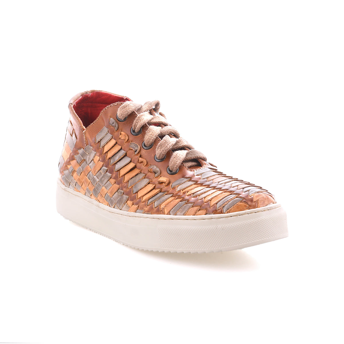 The Bed Stu Unwavering sneaker features handwoven tan, gray, and beige leather strips, beige laces, and a white rubber sole. Displayed against a white background.