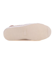 The image displays the bottom view of Bed Stu's Unwavering sneaker, featuring a light-colored sole with a rectangular textured grip and horizontal grooves characteristic of its dimensional pattern.