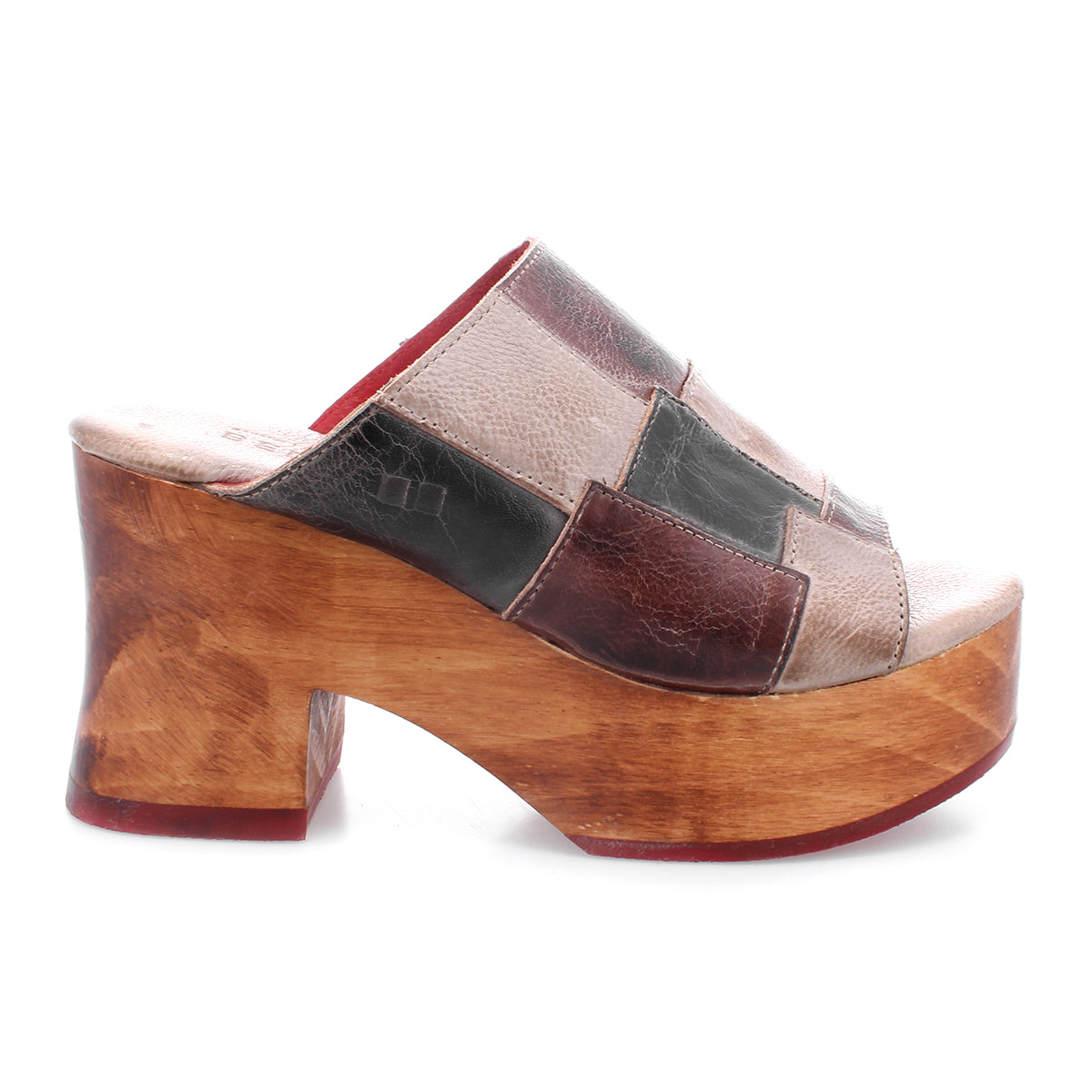 A women's Vanquish wooden clog with an open-toe design and a patchwork pattern by Bed Stu.
