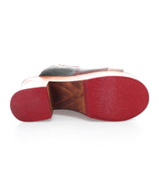 A pair of Vanquish shoes by Bed Stu with red and black soles featuring an open-toe design.